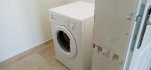 a washer and dryer sitting in a room at Fridolins Family Apartment - Ferienwohnung im Südburgenland in Markt Allhau