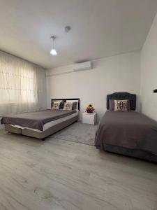 a bedroom with two beds in a room at HAPPY HOUSE 2 Pamukkale in Pamukkale