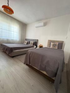 a bedroom with two beds in a room at HAPPY HOUSE 2 Pamukkale in Pamukkale +13 photos