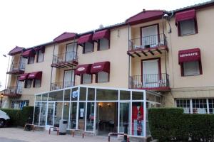 a large building with windows and balconies at Hostal Pancorbo in Pancorbo