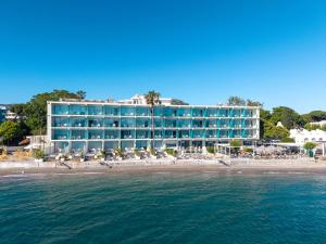 a hotel on the beach near the water at Kos Aktis Art Hotel in Kos
