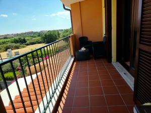 a balcony with a view of the countryside at Casa Giulia Olbiamare in Olbia