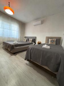 a bedroom with two beds in a room at HAPPY HOUSE 2 Pamukkale in Pamukkale