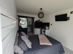 a bedroom with a bed and a television in it at 284 on circular 3 in Sunridge Park +3 photos