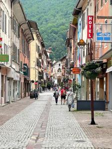 a group of people walking down a city street at Appartement Moutiers Centre in Moutiers