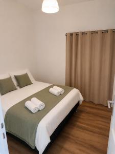 a bedroom with two beds with towels on them at Slimmo Studio in Château-Chinon