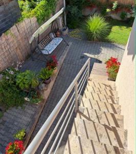 a set of stairs with a bench and some plants at Jasmin in Jošanička Banja