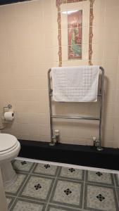 a bathroom with a towel hanging on a towel rack at Ye Olde Red Horse in Evesham