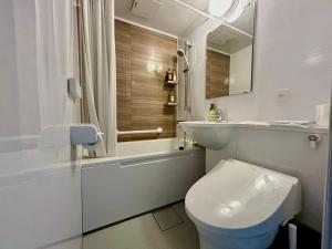 a bathroom with a toilet and a sink and a shower at 日和のすみか in Ichihara +39 photos