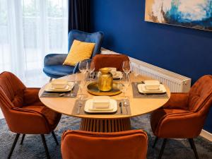 a dining room with a table and chairs at Luxury Apartment Königsallee Old Town Rhine Promenade Messe in Düsseldorf