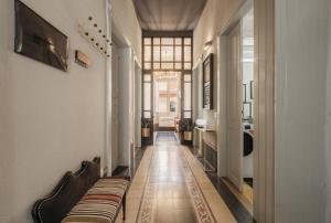 a hallway with two beds in a room at guesthouse Electra in Iglesias
