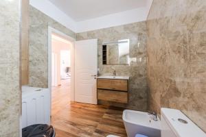 a bathroom with a sink and a toilet at Siar The Large Villa by PikHost in Borsh +87 photos