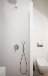 a bathroom with a shower and a toilet at À La Plage Residences 03 in Platis Gialos +43 photos
