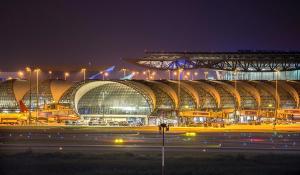 a large stadium at night with lights in front of it at KaizaHotel Suvarnabhumi Airport in Lat Krabang