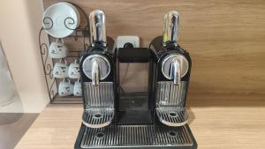a black coffee maker sitting on top of a counter at Studio au cœur de Cerdagne in Bourg-Madame