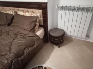 a bedroom with a bed and a radiator at اقامة جاد in Oran