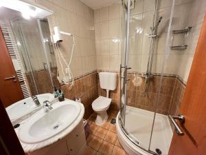a bathroom with a toilet and a sink and a shower at Guest House Lav in Primošten +84 photos