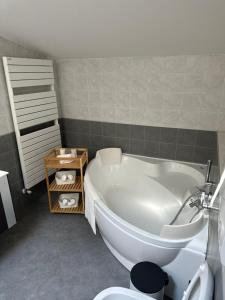 a bathroom with a white tub and a toilet at Venice Airport House in Venice +34 photos