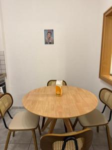 a wooden table with a drink on top of it at Retro Style in Erfurt in Erfurt