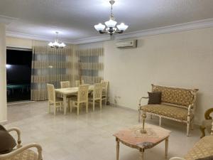 a living room with a table and chairs at Dar Emna in Hammamet