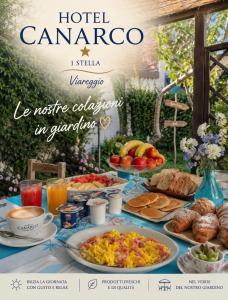 a table full of breakfast foods and drinks at Hotel Canarco in Viareggio