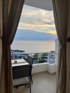 a balcony with a view of the ocean at Bluemoon Suites Sarande in Sarandë