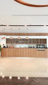 a large lobby with a bar in a building at Hills Managed by Dedeman in Erbil
