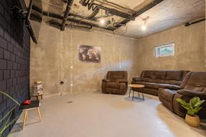 a living room with a couch and two chairs at Villa Omaha in Vekići