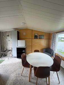 a meeting room with a white table and chairs at Arctic Motel and Kautokeino Camping in Kautokeino +15 photos