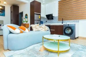 a living room with a couch and a table at ORIGAMI APARTMENTs in Boi