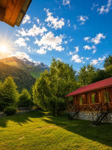 a cabin with a view of the mountains at Ushba Hill Panoramic Lodge Becho in Mestia +91 photos