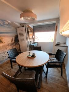 a dining room with a table and chairs at Eos in Piran