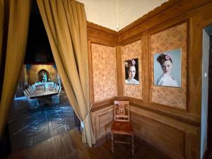 a room with two pictures of women on the wall at Laitse Castle B&B in Laitse +20 photos