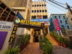a building with a sign for a restaurant at Hotel Puri Waves - Near Blue Flag Beach - Restautant, Parking & Spa in Puri