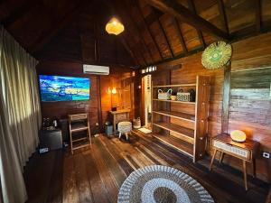 an overhead view of a living room with wood paneling at Zen Tree House in Silebeng