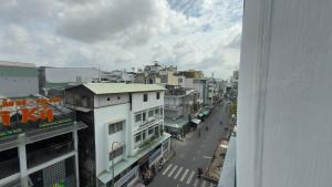 an overhead view of a city street with buildings at Ann Arbor Hotel in Ho Chi Minh City