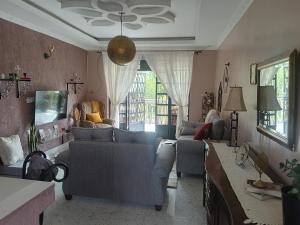 a living room with two couches and a couch at Sereni stays in Nakuru