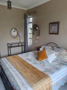 a large bed in a bedroom with a window at Sereni stays in Nakuru