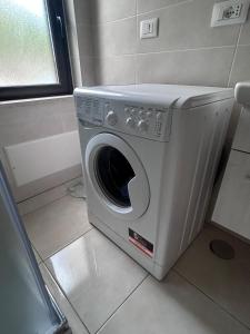 a washing machine is sitting in a bathroom at Villa del Limone in Sellia Marina