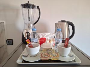 a tray with two cups and a blender on a counter at S1 Modern & Relax in Agadir