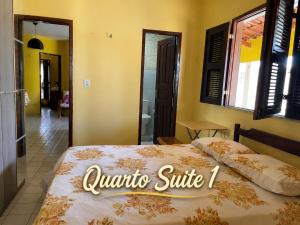 a bedroom with a bed with a sign that reads ontario shuttle at Paracuru Praia in Paracuru