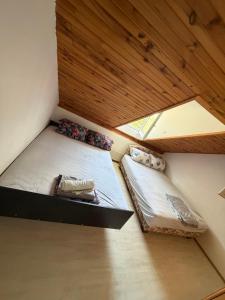 two bunk beds in a room with a ceiling at Vila Jovicic in Popadić
