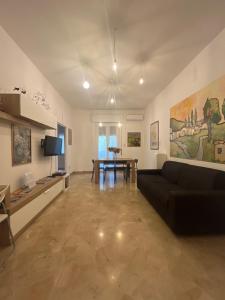 a living room with a couch and a table at Alloggio Primavera in Terni