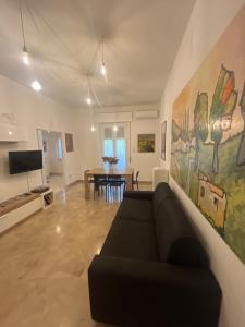 a living room with a couch and a table at Alloggio Primavera in Terni +23 photos