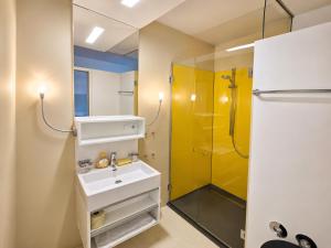 a bathroom with a sink and a shower at Sun Matrei Apartments in Matrei in Osttirol +44 photos