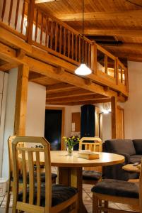 a dining room with a wooden table and chairs at Sun Matrei Apartments in Matrei in Osttirol