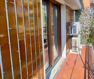 a glass door of a building with a window at Moderno Bilocale Bresso in Bresso