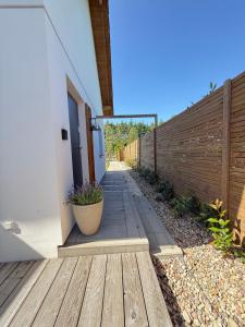 a wooden walkway next to a fence at Cozy House in Świnoujście +12 photos