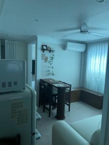 a living room with a table and a dining room at Daejeon Motto stay in Daejeon