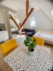 a room with a table with a potted plant on it at Apartmány Lednice in Lednice